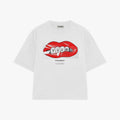 A white short-sleeve t-shirt with a graphic of red lips containing the word 'YUUM' in white, with 'PALMIKA' printed below it, shown on a plain white background.